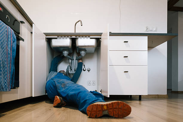 Professional Plumbing technician working in Amana, IA